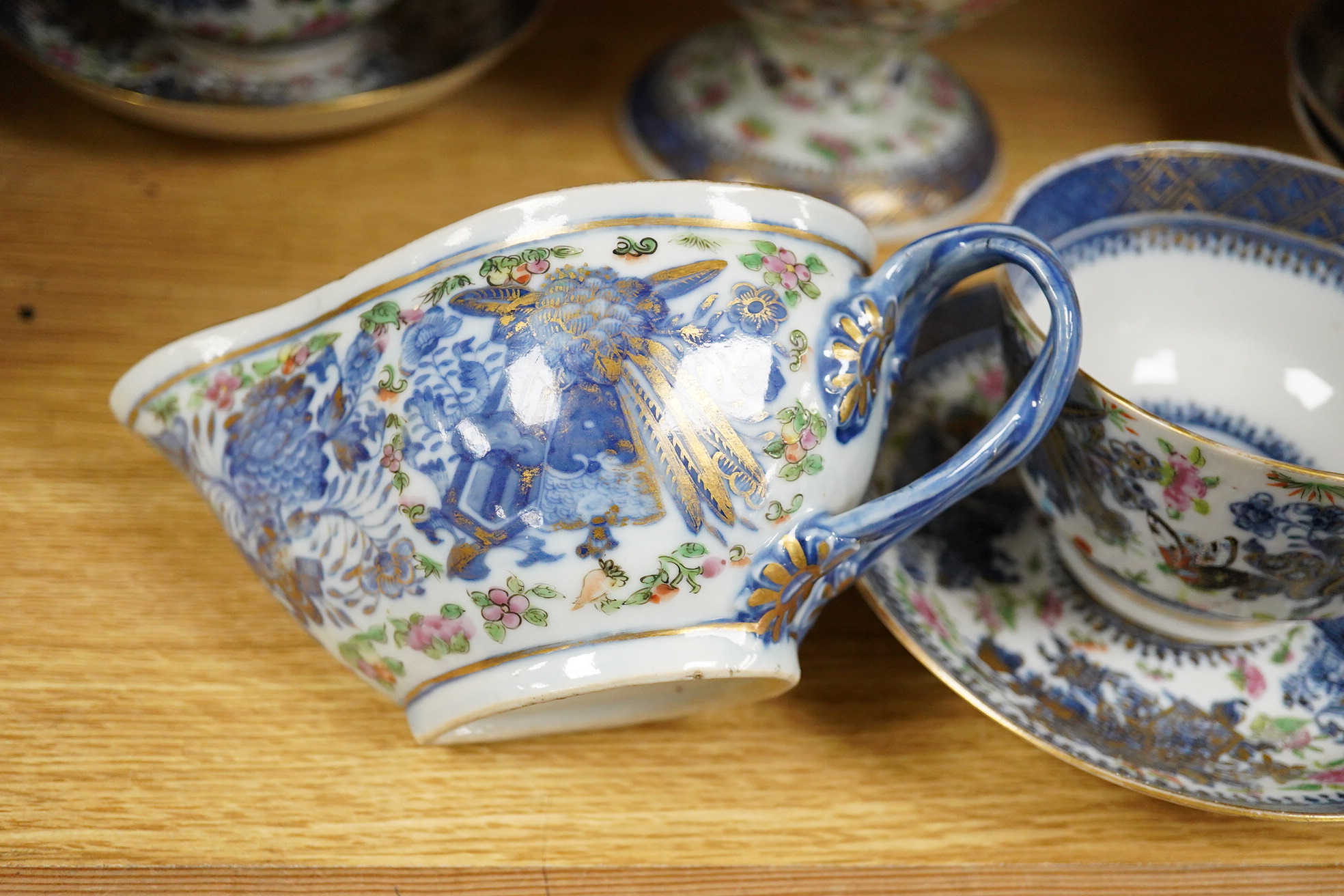 An early 19th century Chinese porcelain part tea set and matching sauce boat - teapot 25cm high